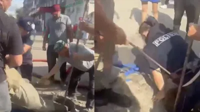 Двое рабочих потеряли сознание в люке: момент спасения сняли на видео